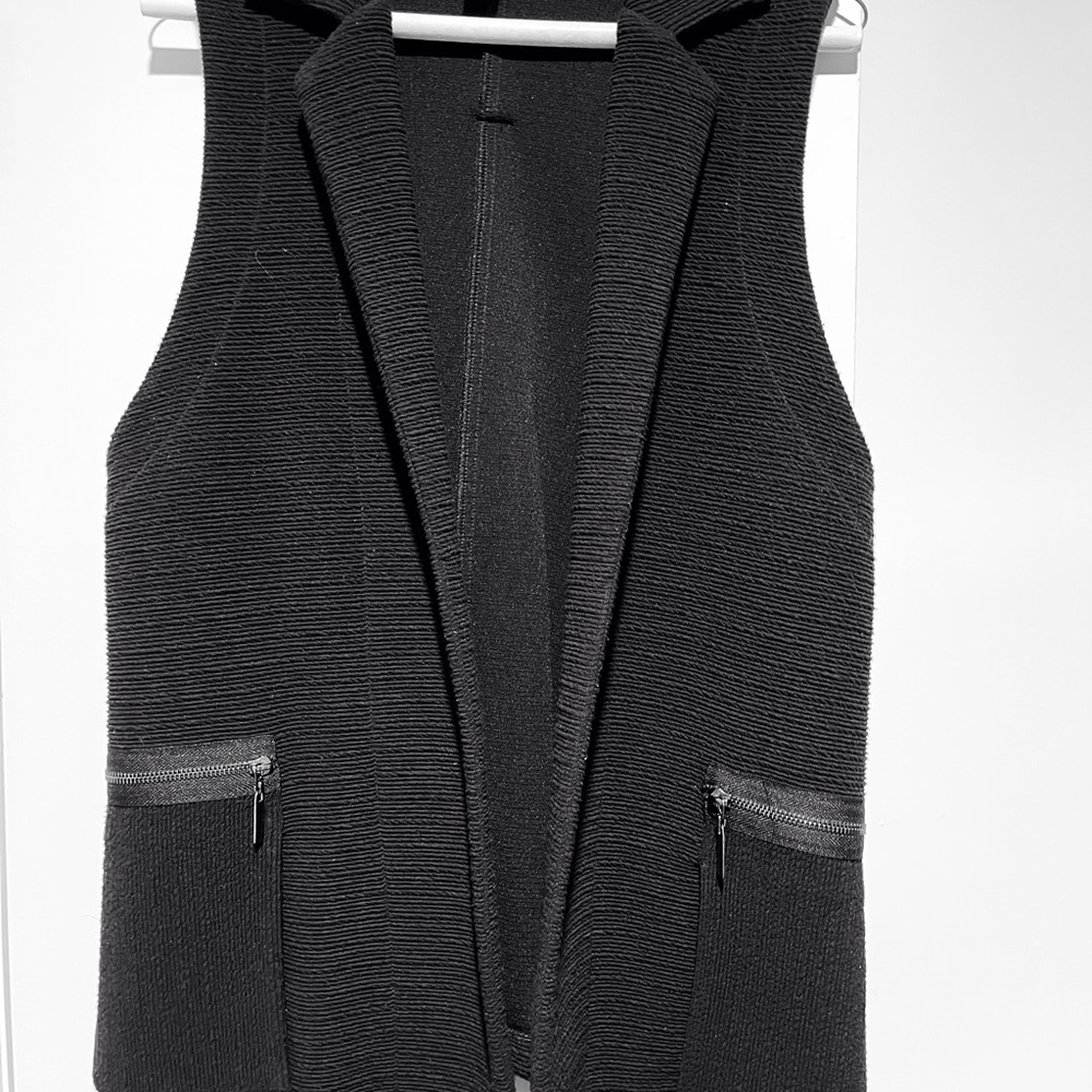 Style galore - sleeveless black vest.   Joseph Ribkoff.  12